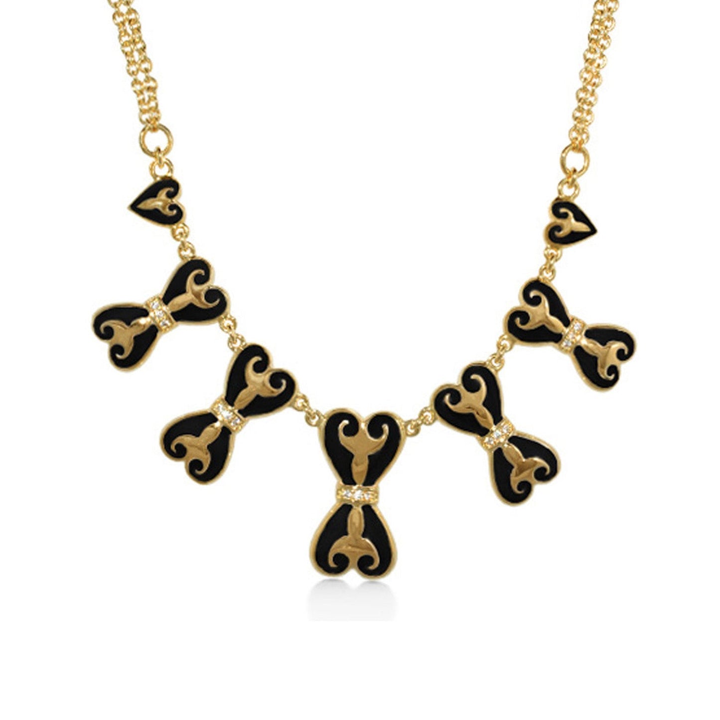 Bows and Hearts Necklace by Lauren G Adams with black enamel heart bows on a gold chain on Tampa Home & Garden Store