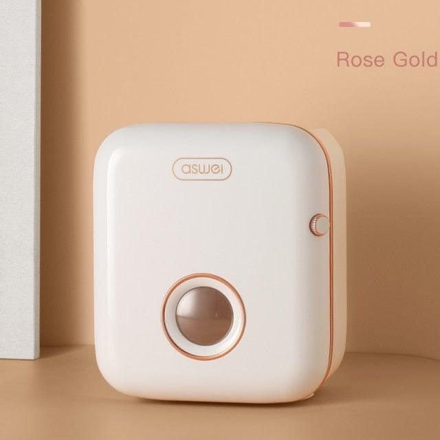 Toilet paper holder Aswei wall mounted white with rose gold trim and round window on Tampa Home & Garden Store