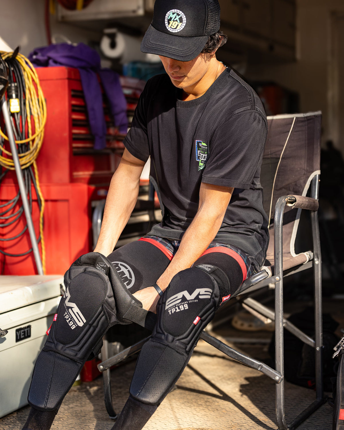 TP199 Blackout Knee Guard by EVS Sports, black knee brace with padded panels on Tampa Home & Garden Store