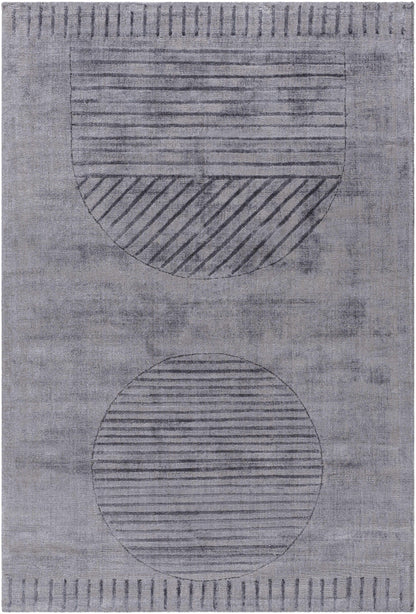 Timna Area Rug by Boutique Rugs in muted gray with circular striped motifs on Tampa Home & Garden Store