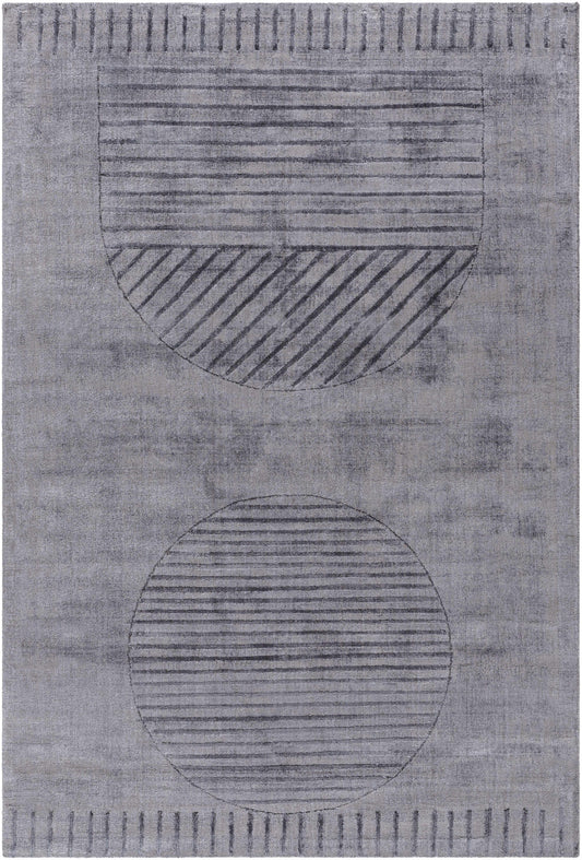 Timna Area Rug by Boutique Rugs in muted gray with circular striped motifs on Tampa Home & Garden Store