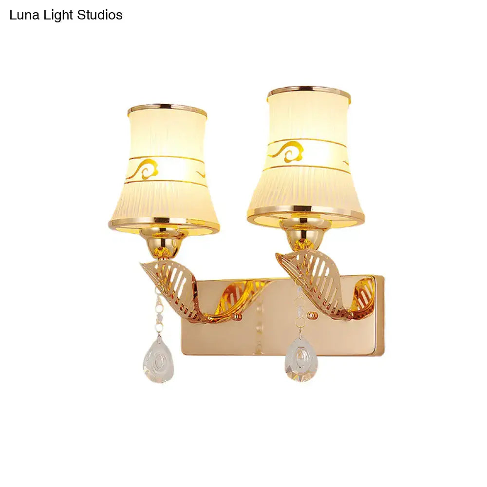 Gold crystal ribbed glass wall sconce with two lights, cream shades hanging crystals Decorbites on Tampa Home & Garden Store