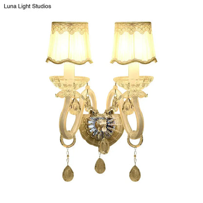 Traditional White Candle Wall Lamp with Clear Crystal Accent and Scalloped Fabric Shade