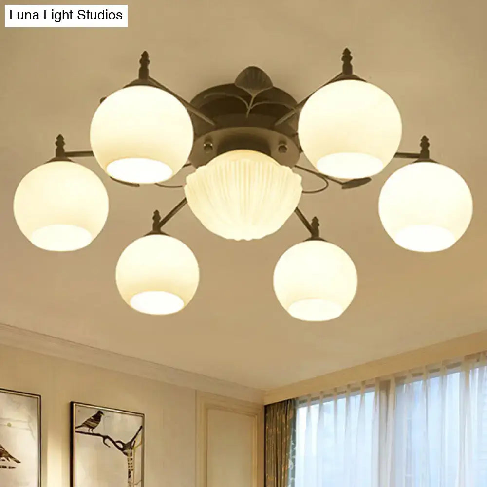 White Glass Bubble Ceiling Light flush mount with 6 white glass globes on a dark metal frame on Tampa Home & Garden Store