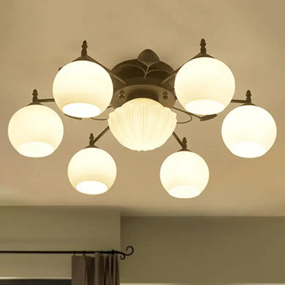 White glass bubble ceiling light by Decorbites with six globe bulbs around a center flush mount on Tampa Home & Garden Store