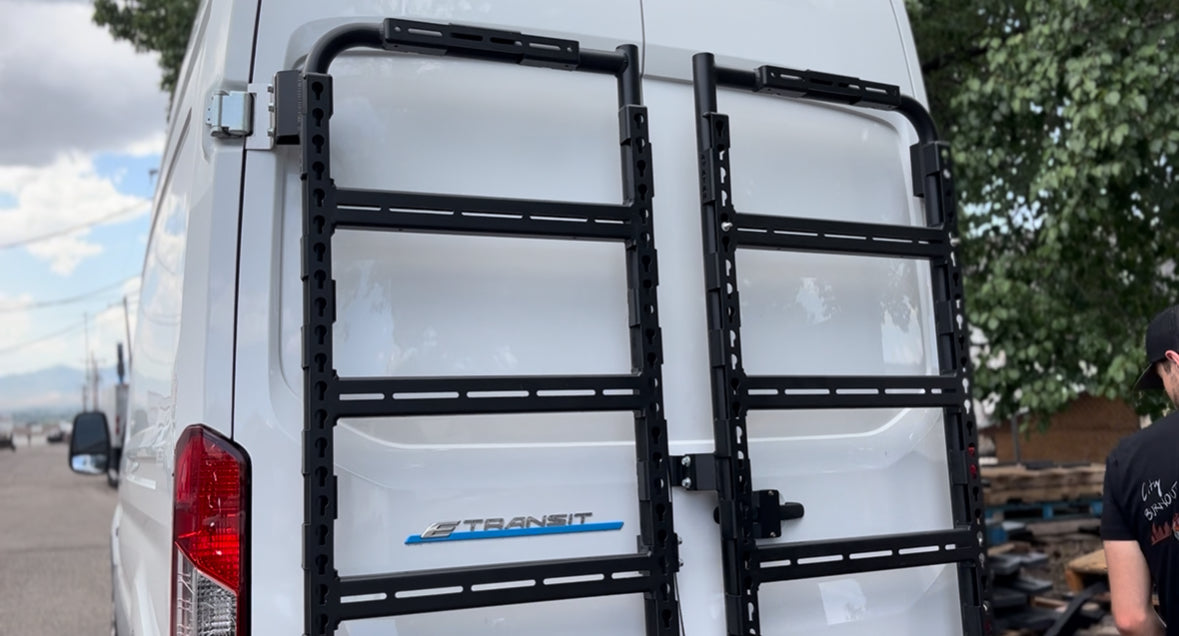 Avatar Massif van rear-door storage mounting system with dual black rails on white Ford Transit on Tampa Home & Garden Store