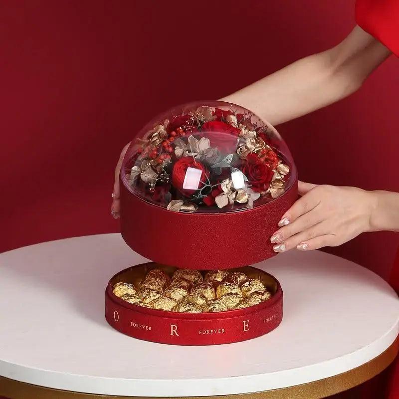 Transparent glass dome chocolate gift box with red base and goldwrapped chocolates Stevvex on Tampa Home & Garden Store