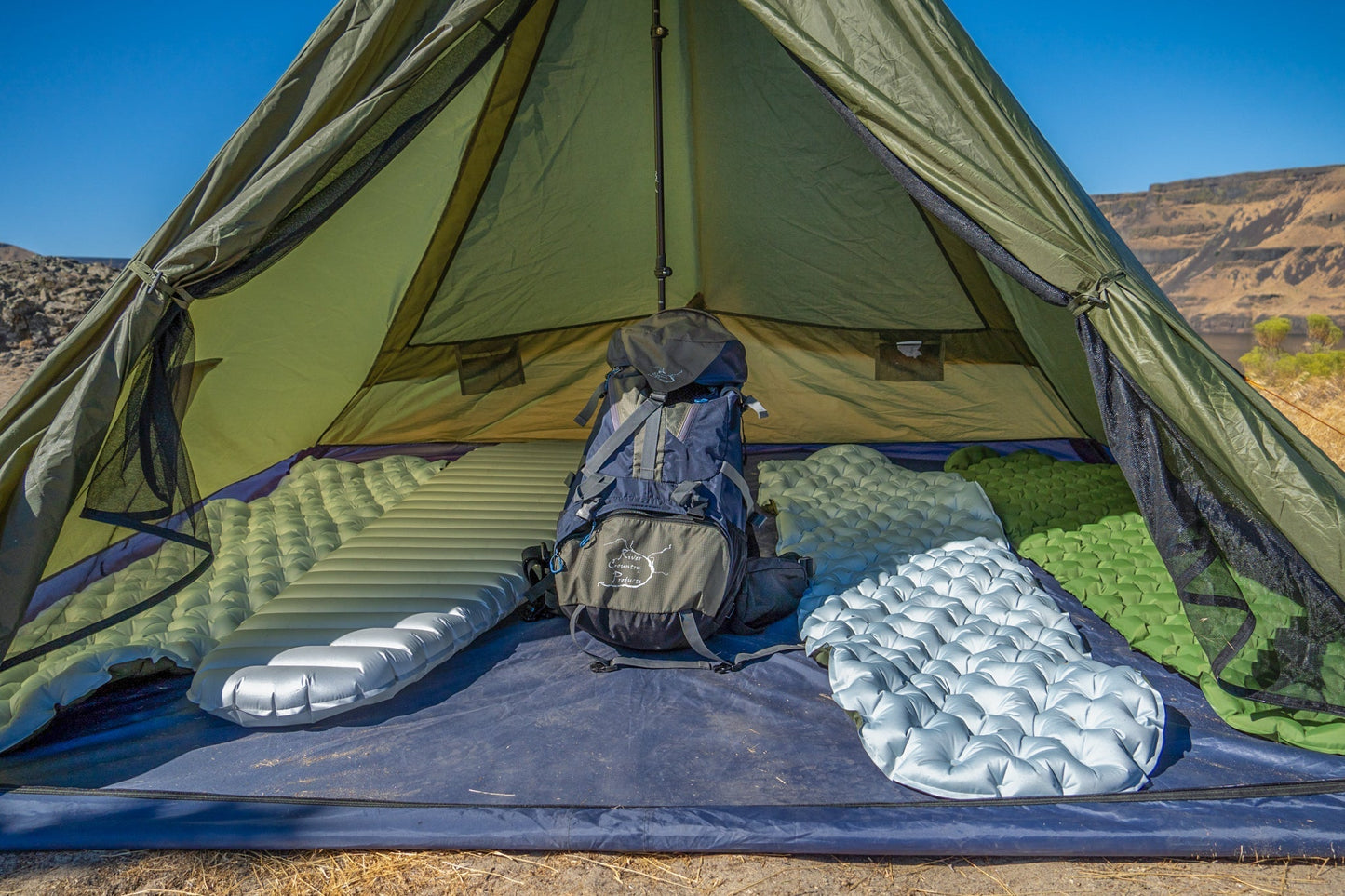 Trekker Tent 4, olive-green 4-person pyramid tent interior with sleeping pads River Country Gear on Tampa Home & Garden Store