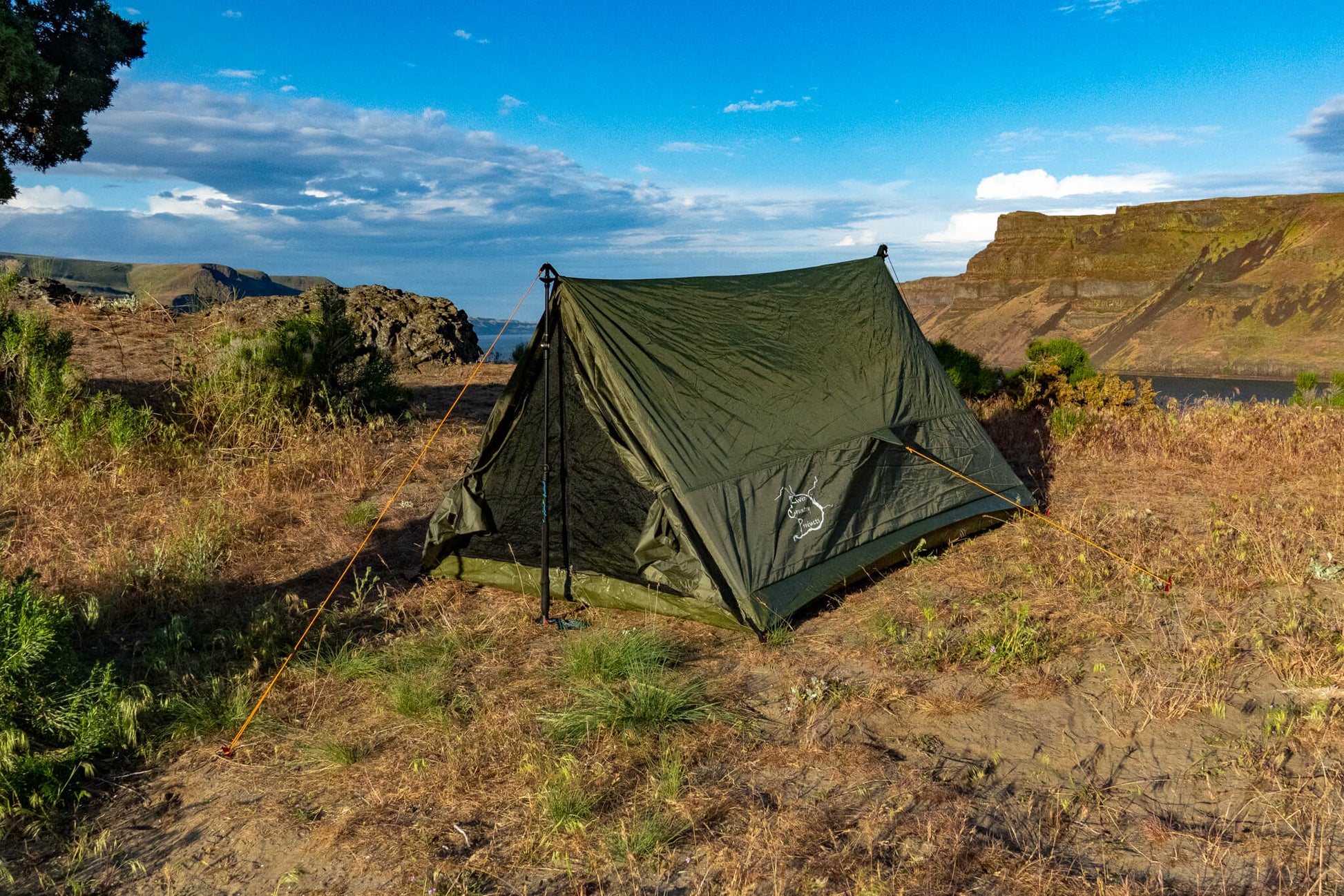 Trekker Tent 2 by River Country Gear, olive green 2-person backpacking tent with orange guy lines on Tampa Home & Garden Store