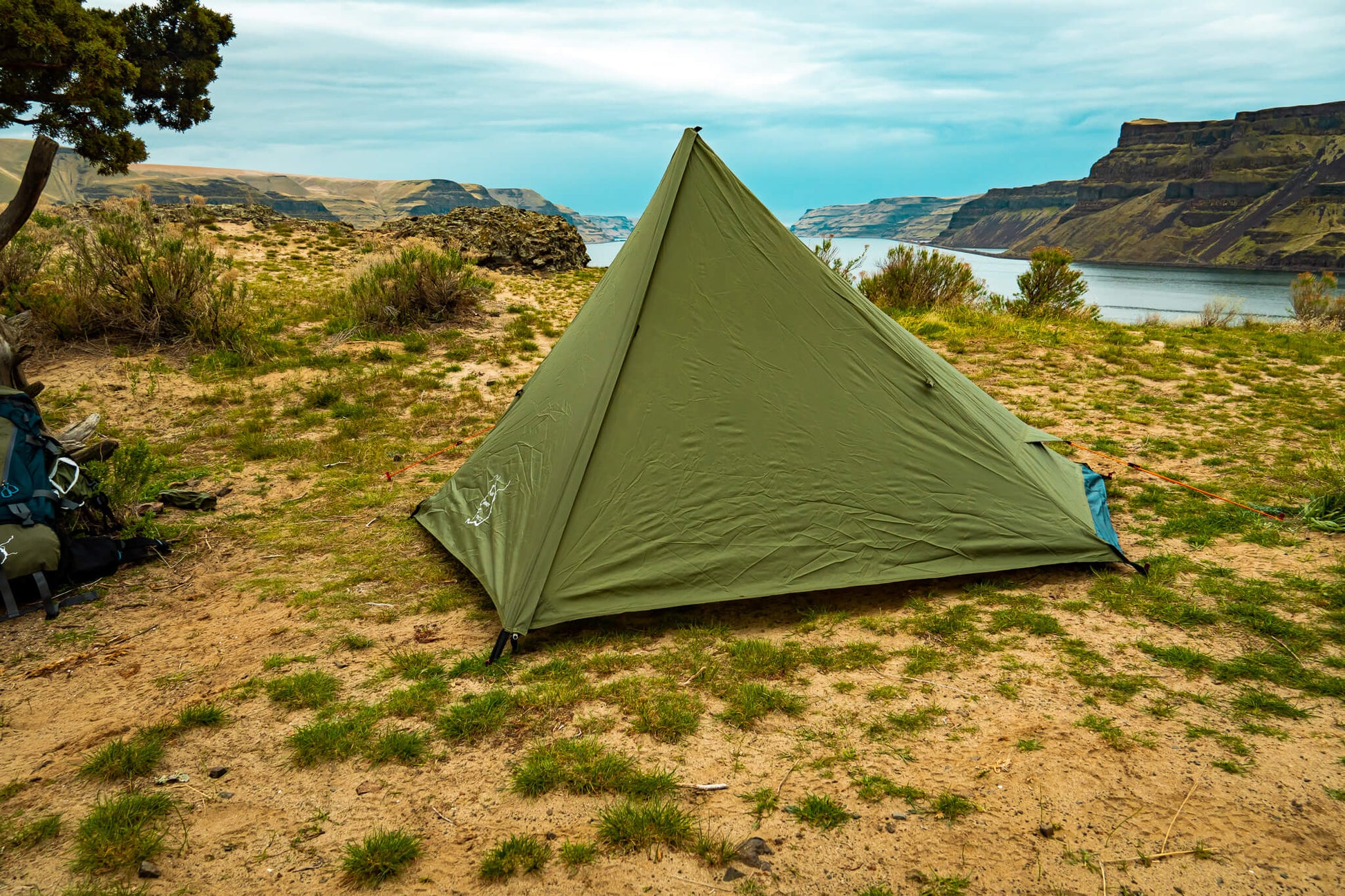 River Country Gear Trekker Tent 1 1-Person Backpacking Tent olive green pitched near lakeside on Tampa Home & Garden Store
