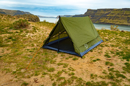 Trekker Tent 2.2 green 2-person backpacking tent by River Country Gear pitched sandy shore on Tampa Home & Garden Store