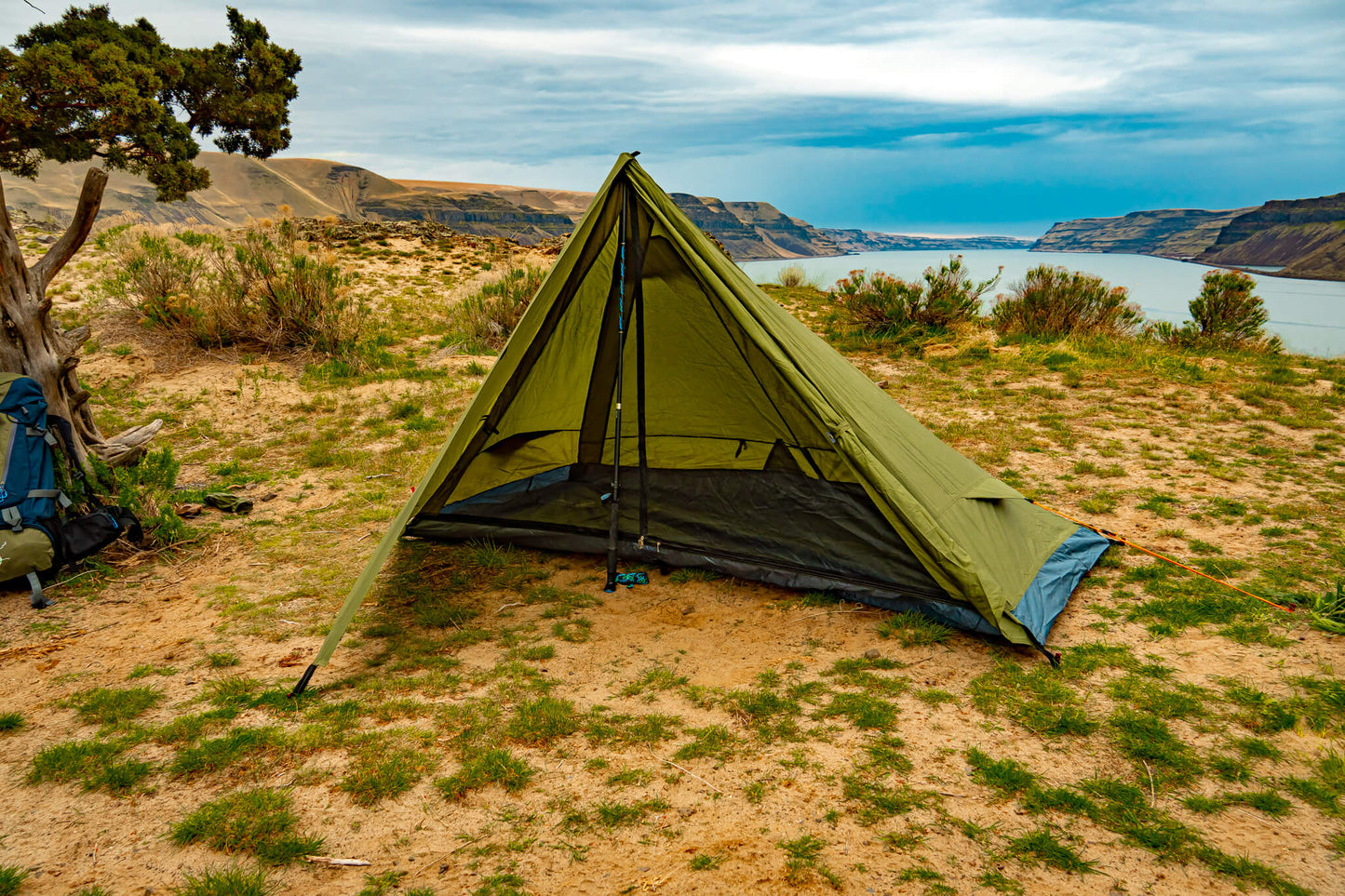 River Country Gear Trekker Tent 1, green 1-person backpacking tent on sandy desert with canyon on Tampa Home & Garden Store