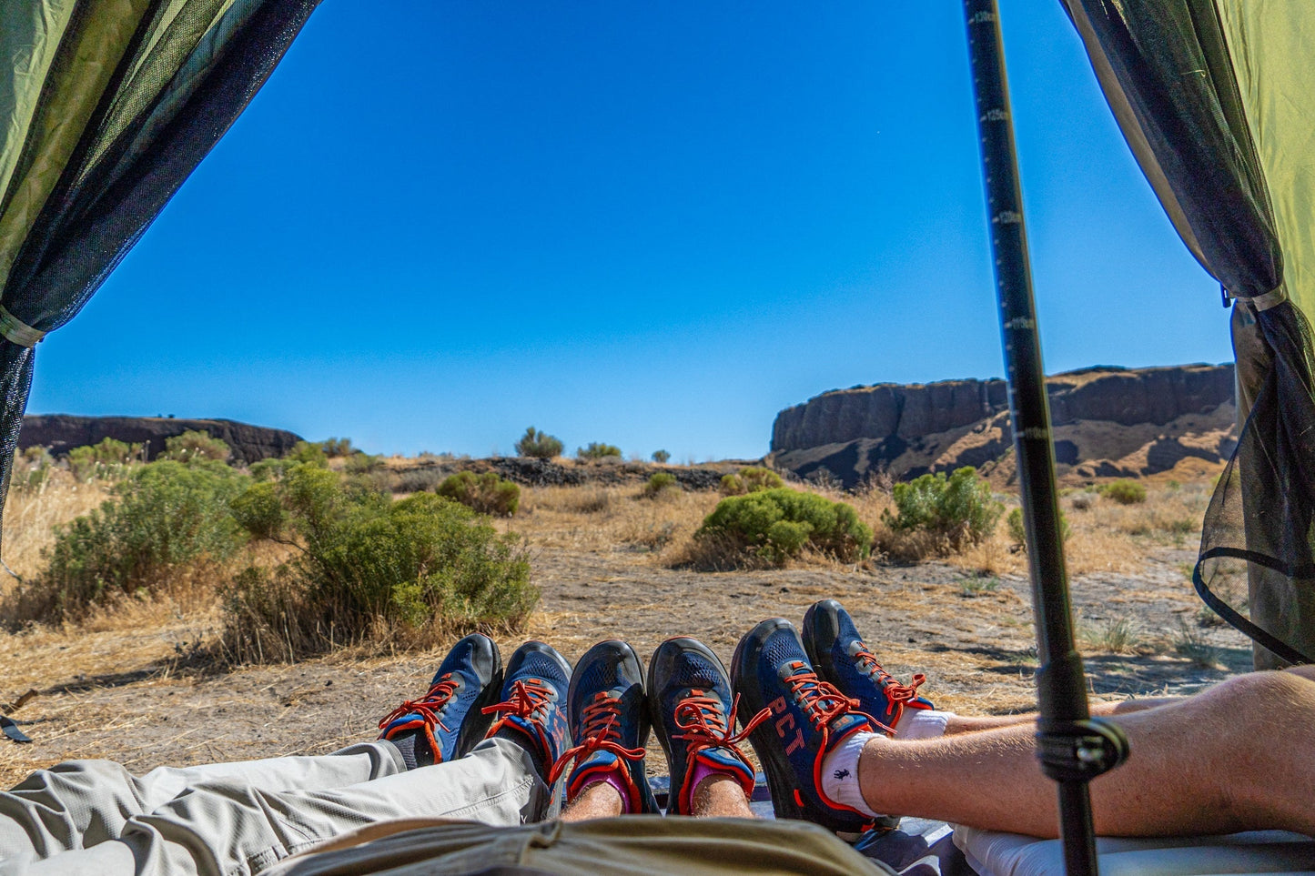 Trekker Tent 4 by River Country Gear, 4-person pyramid tent, interior view with boots on Tampa Home & Garden Store