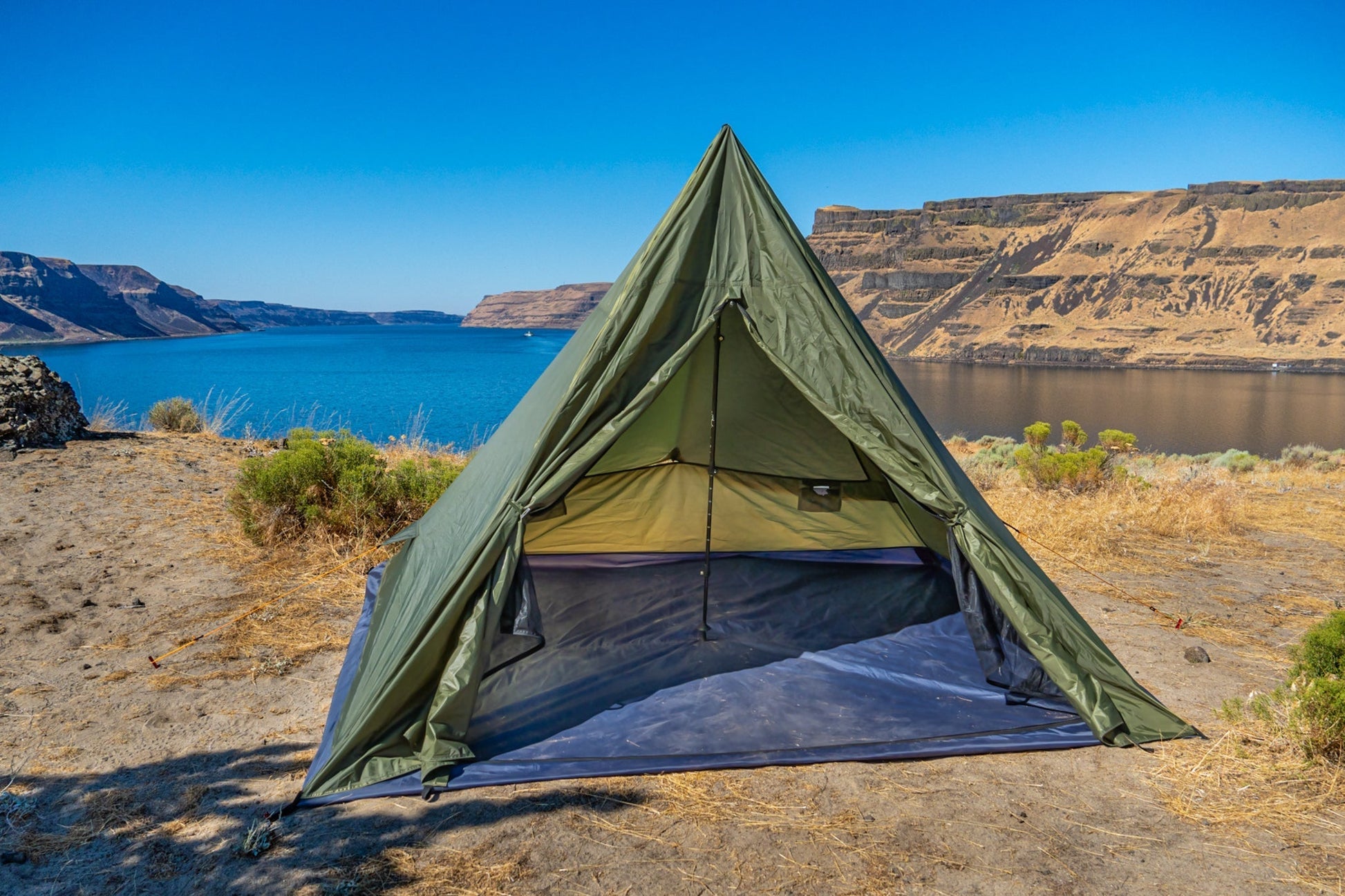 Trekker Tent 4 pyramid camping tent River Country Gear olive green set on desert lakeside on Tampa Home & Garden Store