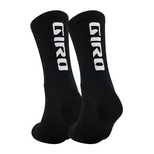 STIL black athletic socks pair with white vertical logo on each sock on Tampa Home & Garden Store