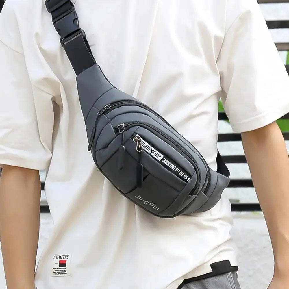 Gray waist pouch bag with multiple zip pockets and adjustable strap worn crossbody on Tampa Home & Garden Store