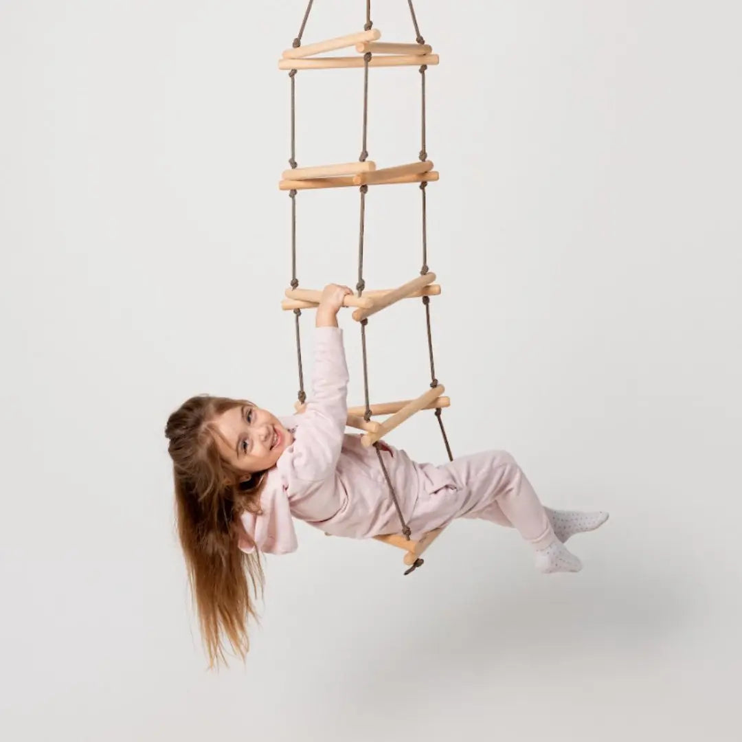 Triangle rope ladder for kids Goodevas single swing rungs rope, child in pajamas swinging on Tampa Home & Garden Store