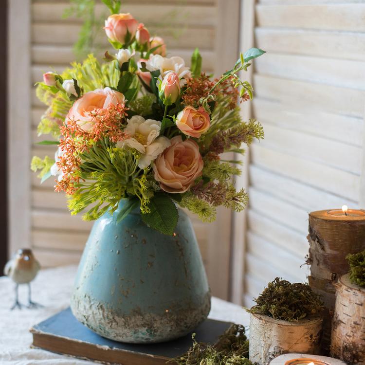 Turquoise ceramic vase with finish holding peach roses and greenery by RusticReach on Tampa Home & Garden Store