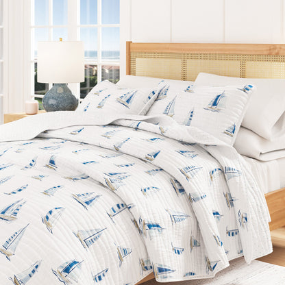 Coastal Blue Sailboat Quilt Set Great Bay Home white background with blue sailboat print on Tampa Home & Garden Store
