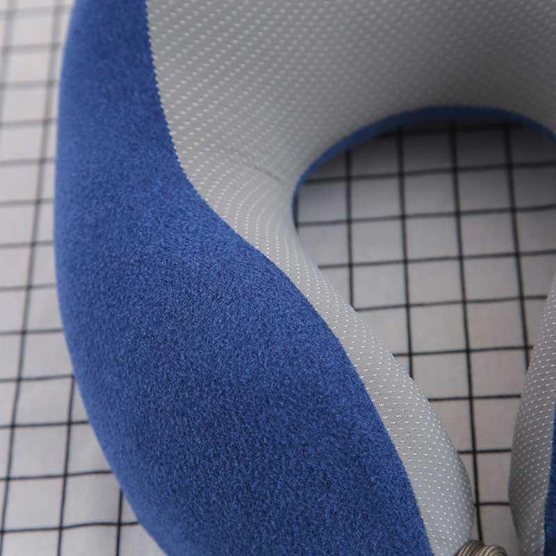 U-shaped travel neck pillow with blue outer fabric and gray dotted inner fabric on Tampa Home & Garden Store