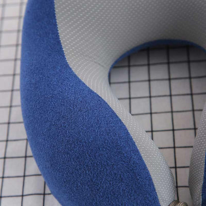U-shaped travel neck pillow with blue outer fabric and gray dotted inner fabric on Tampa Home & Garden Store