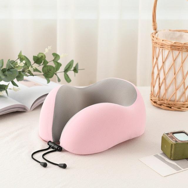Pink U-shaped memory foam travel neck pillow with grey interior for airplane and car comfort on Tampa Home & Garden Store