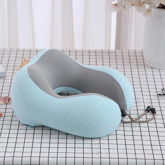U-shaped light blue travel neck pillow with gray inner lining memory foam padding for travel on Tampa Home & Garden Store