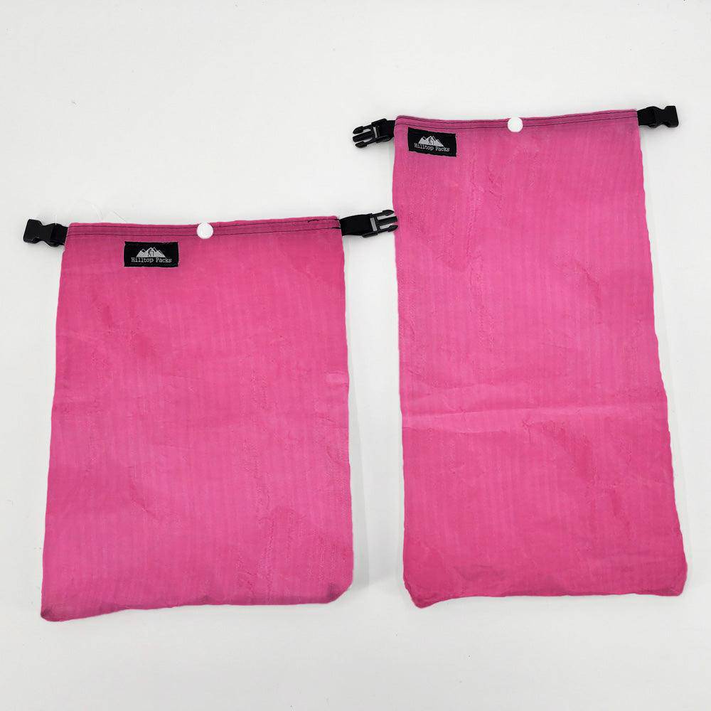 Ultralight Ditty Bag pair in bright pink nylon with black clips and Hilltop Packs LLC logo on Tampa Home & Garden Store