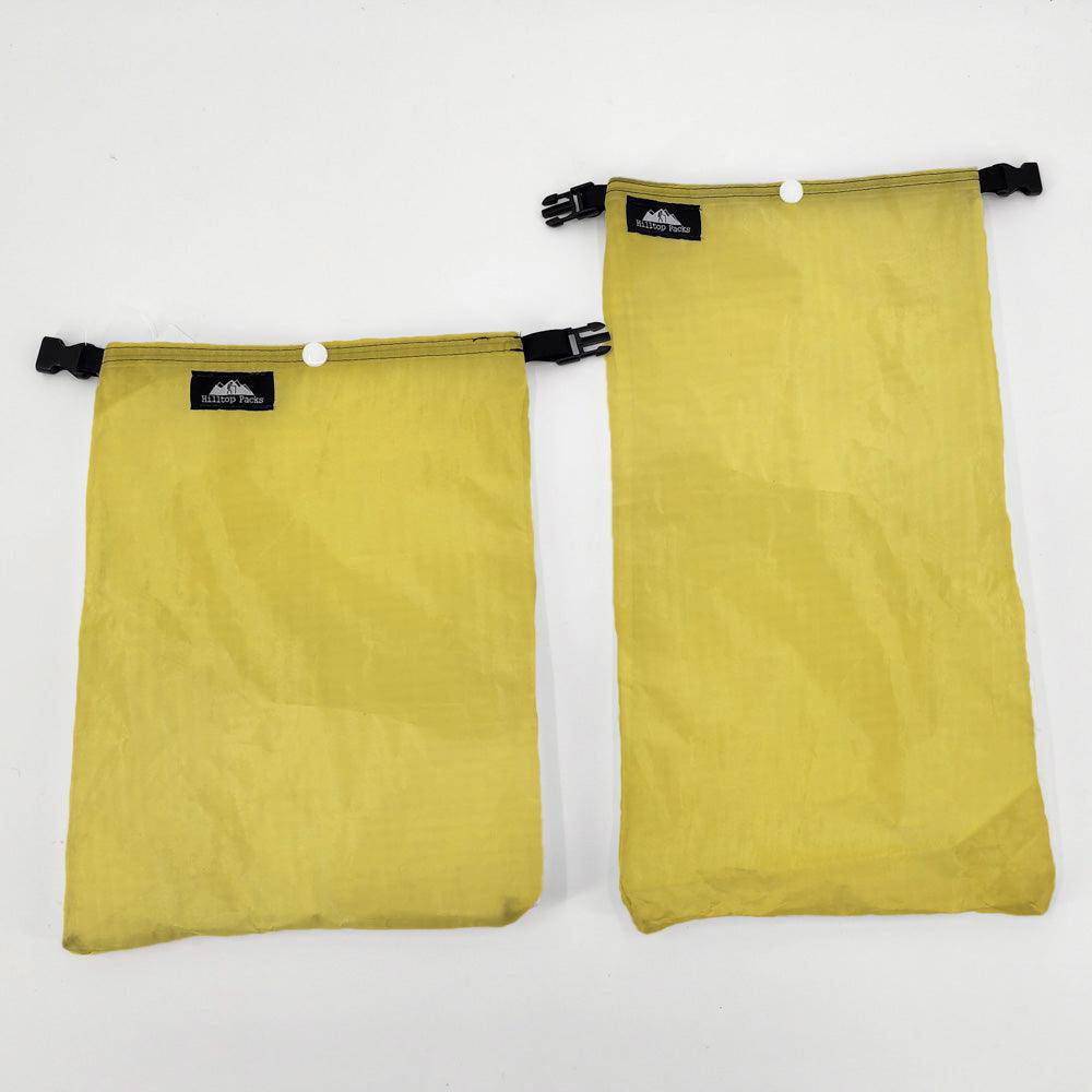 Ultralight Ditty Bag printed gear organizer, two yellow pouches with Hilltop Packs LLC logos on Tampa Home & Garden Store