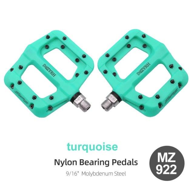 Bicycle flat pedals turquoise nylon bearing pair by Stevvex with 9/16 inch molybdenum steel axles on Tampa Home & Garden Store