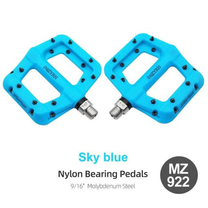 Pair of sky blue Stevvex nylon bearing bicycle pedals with flat platform and steel axles on Tampa Home & Garden Store