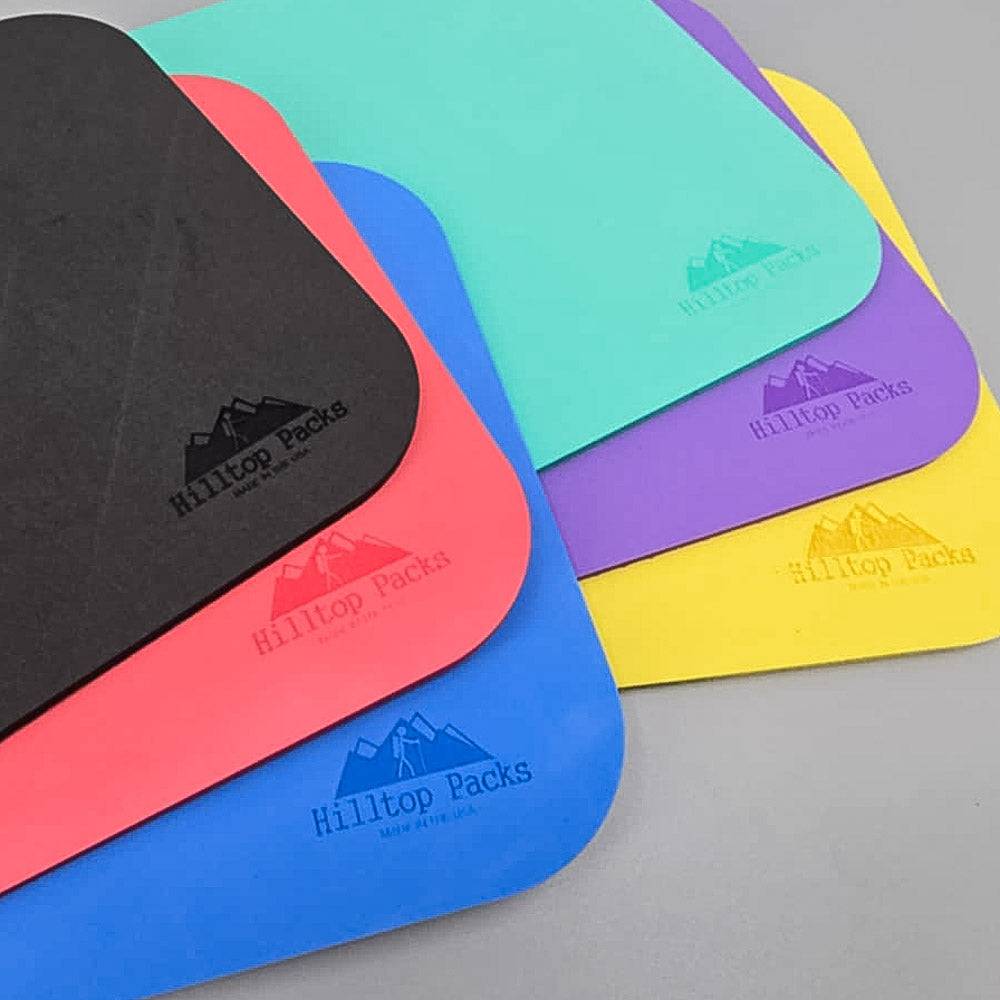 Ultralight Sit Pad 6 foam pads stacked in black pink teal purple blue yellow Hilltop Packs LLC on Tampa Home & Garden Store
