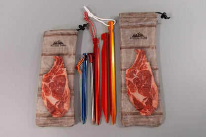 Ultralight Tent Stake Bag with meat-print pouches beige drawstring bags by Hilltop Packs LLC hold red, orange, blue and silver stakes on Tampa Home & Garden Store