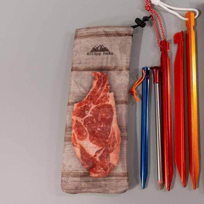 Ultralight tent stake bag with wood print by Hilltop Packs includes blue red and gray stakes on Tampa Home & Garden Store