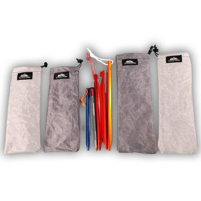 Ultralight Tent Stake Sack D50T by Hilltop Packs LLC set of five gray bags with logo stakes on Tampa Home & Garden Store