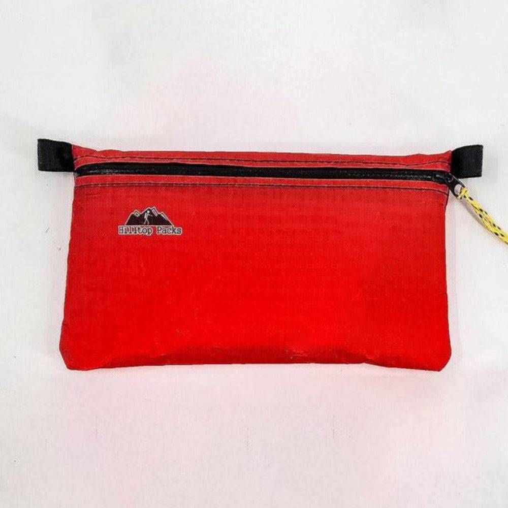 Ultralight pouch organizer red with black zipper and yellow pull Hilltop Packs LLC logo on Tampa Home & Garden Store