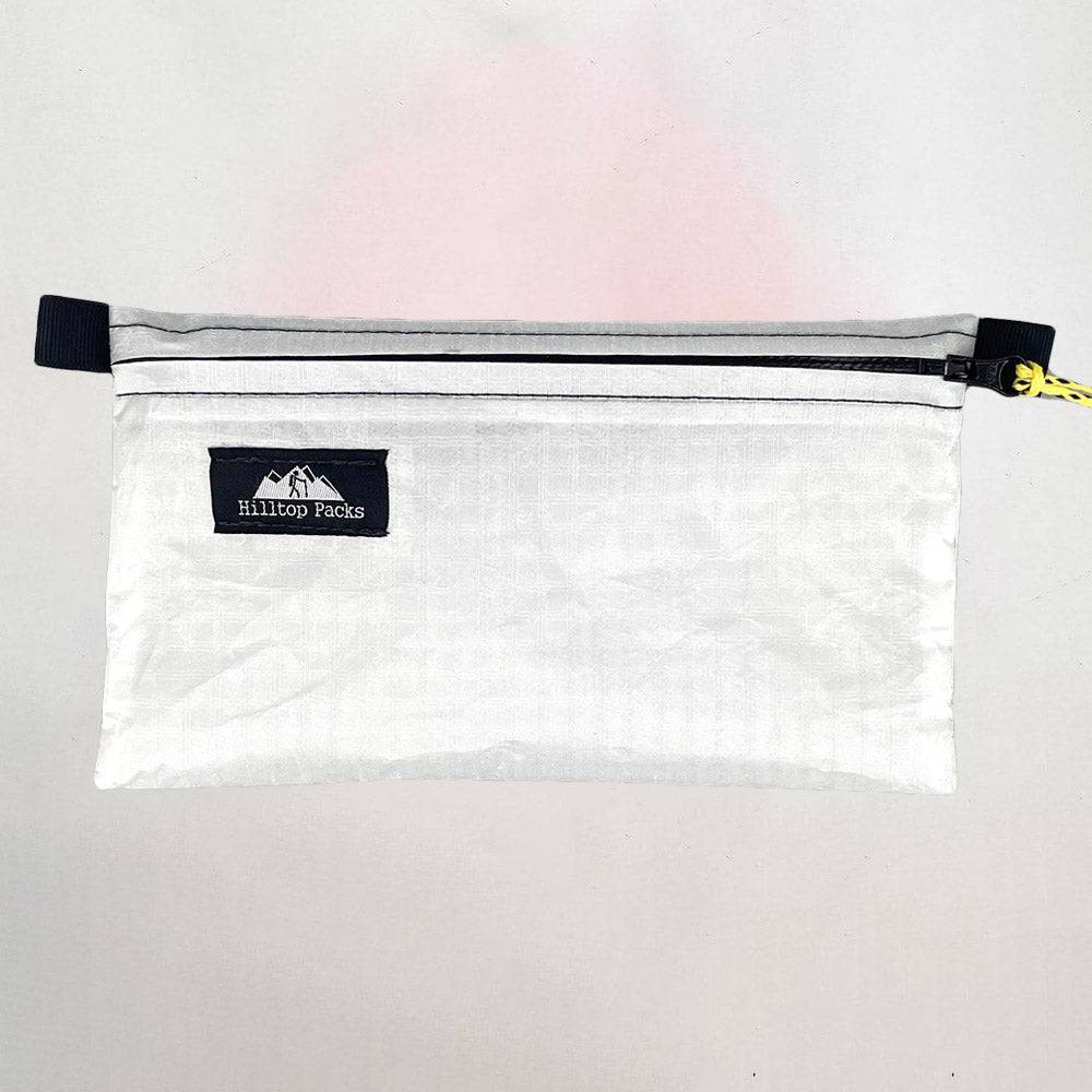 Ultralight zipper pouch organizer Series 1 in white with black zipper and Hilltop Packs logo on Tampa Home & Garden Store