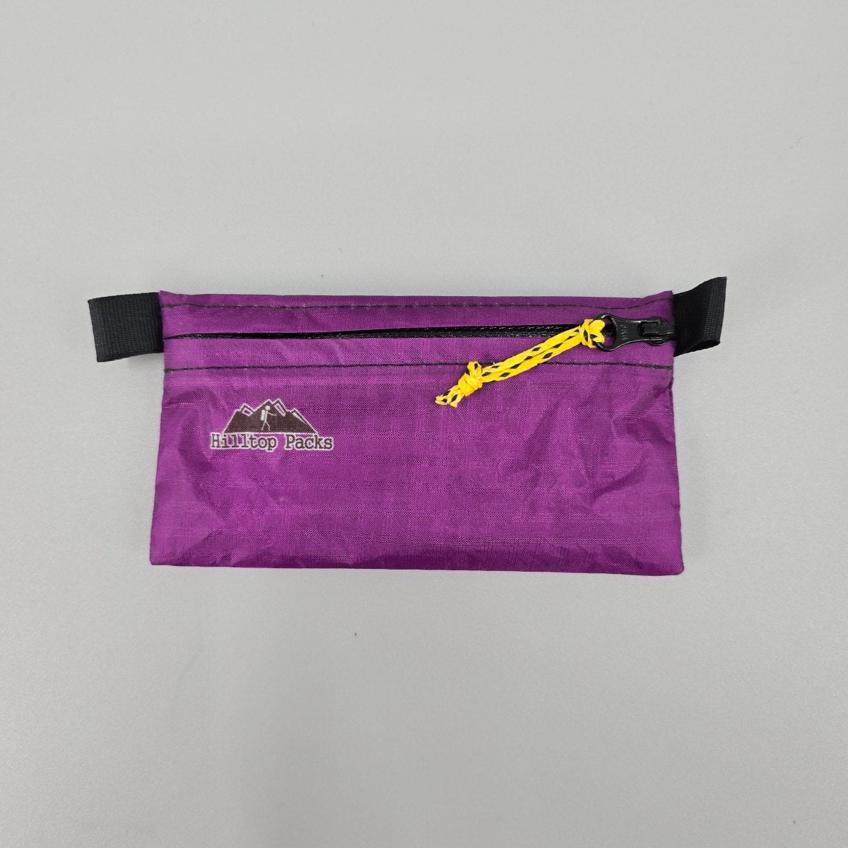 Ultralight Zipper Pouch Organizer with black end straps and yellow zipper Hilltop Packs logo on Tampa Home & Garden Store