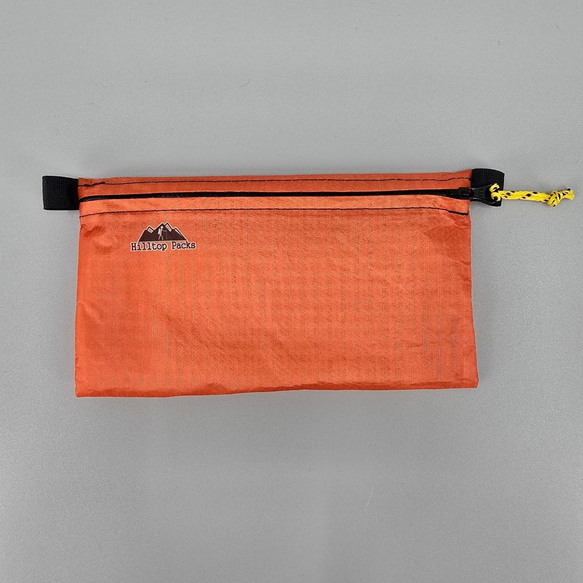 Ultralight zipper pouch organizer orange fabric with Hilltop Packs LLC logo travel pouch on Tampa Home & Garden Store