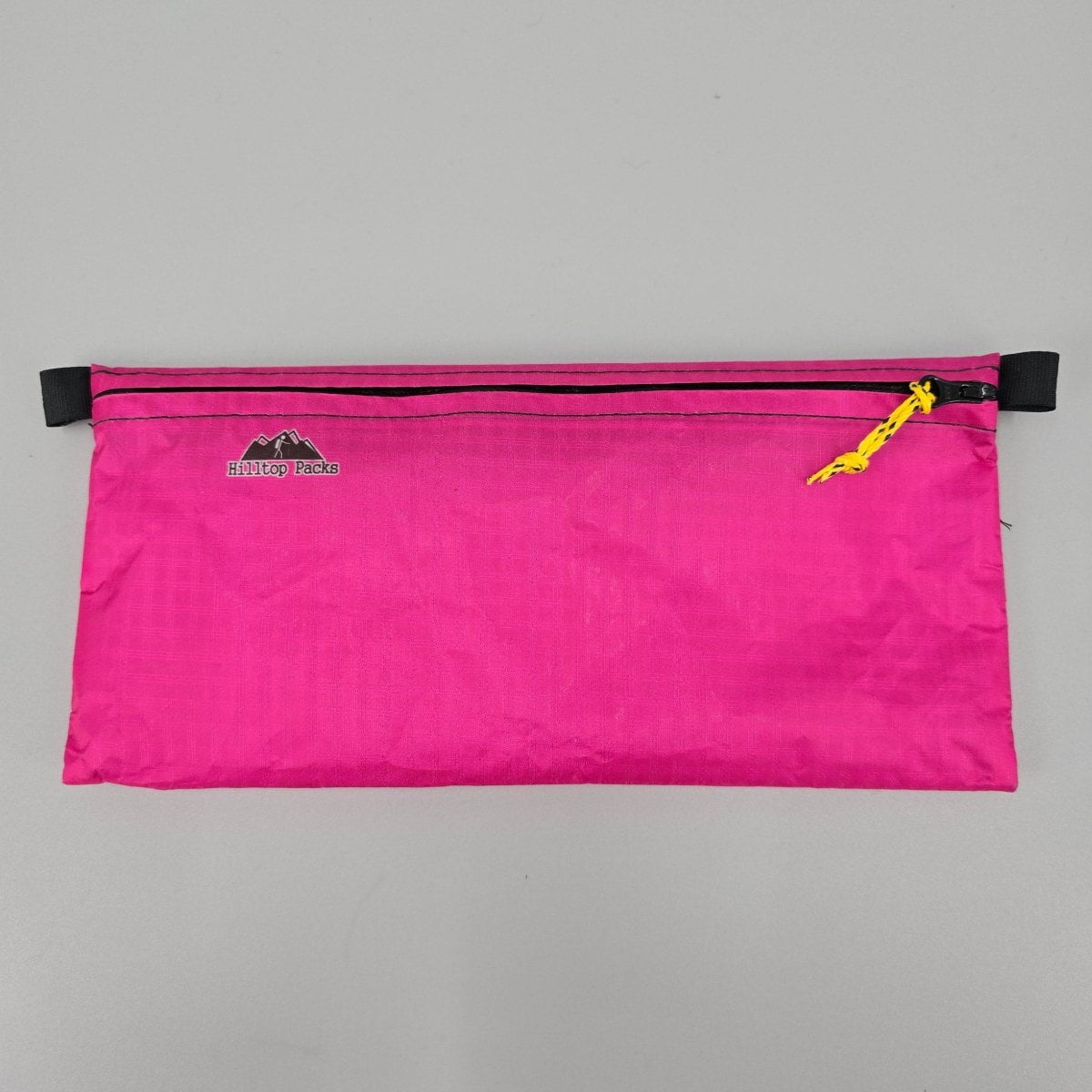 Ultralight zipper pouch organizer pink with black zipper and yellow pull Hilltop Packs logo on Tampa Home & Garden Store