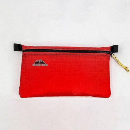Red ultralight zipper pouch with black zipper, yellow braided pull, Hilltop Packs LLC logo pouch on Tampa Home & Garden Store