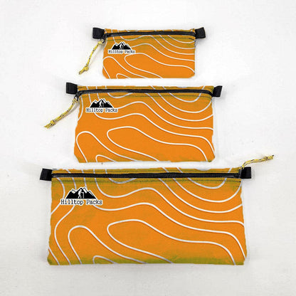 Ultralight Zipper Pouch Series 3 three orange pouches with white waves Hilltop Packs camping gear on Tampa Home & Garden Store