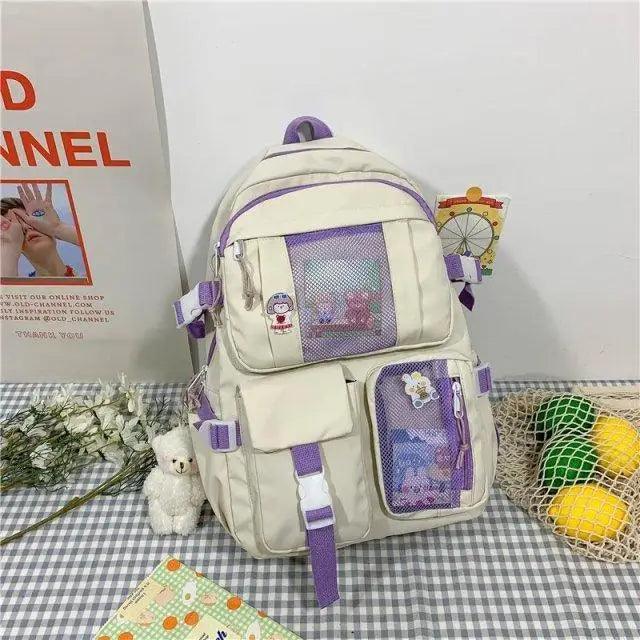 Stevvex cream large-capacity school backpack with purple zippers and mesh front pockets on Tampa Home & Garden Store