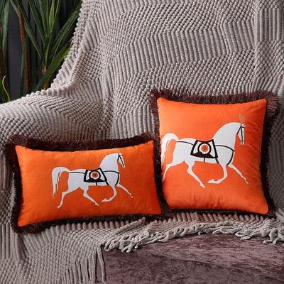 Stevvex orange horse-printed lumbar cushion covers with black tassel edge, pair on grey knit on Tampa Home & Garden Store