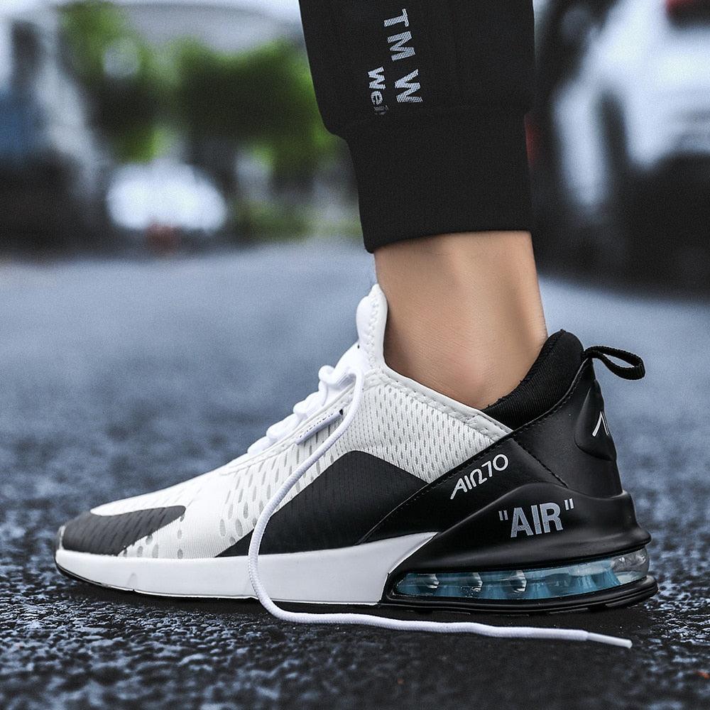 Stevvex unisex air cushion running shoe, white mesh upper with black heel and blue air sole on Tampa Home & Garden Store