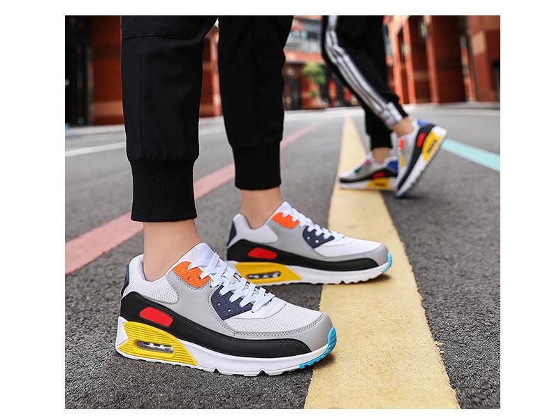 Two Stevvex unisex air cushion sneakers, colorful white mesh with orange blue yellow accents on Tampa Home & Garden Store