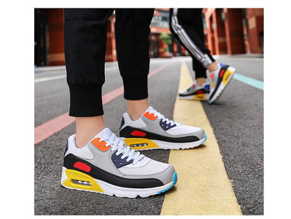 Two Stevvex unisex air cushion sneakers, colorful white mesh with orange blue yellow accents on Tampa Home & Garden Store