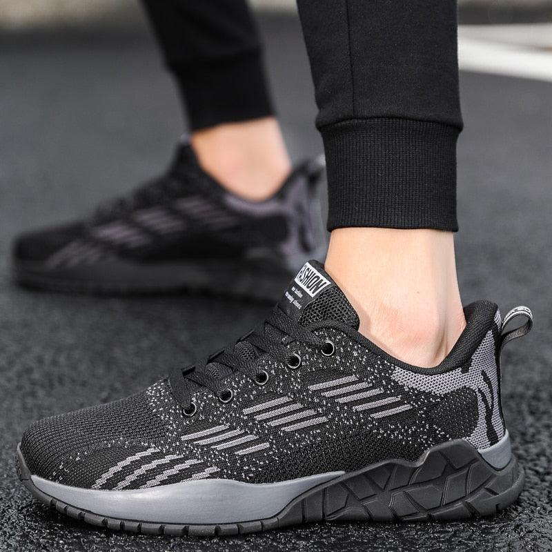 Stevvex unisex running sneaker with black knit upper and gray camo accents; lace-up, outsole on Tampa Home & Garden Store