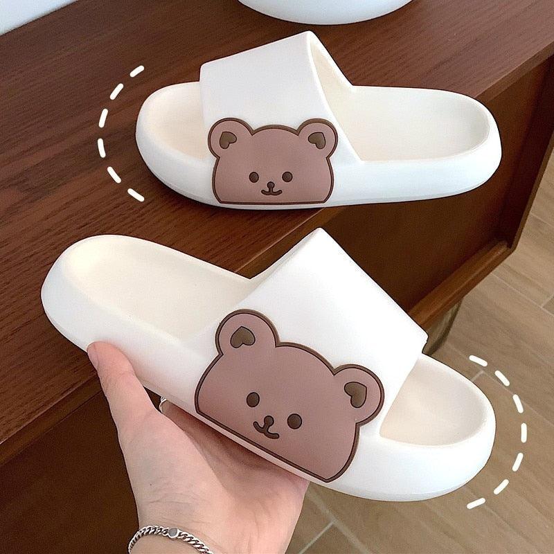 Unisex thick-sole Stevvex slides in white with brown bear graphic on strap on Tampa Home & Garden Store