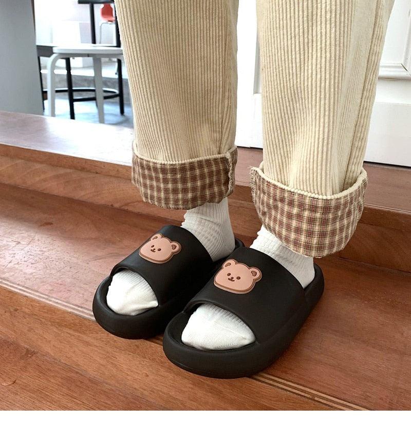 Unisex thick sole slides Stevvex, black bear-logo sandals pair on Tampa Home & Garden Store